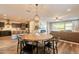 Dining area with views into the living area and the kitchen featuring an island at 4337 S Helix --, Mesa, AZ 85212