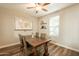 Charming dining room with wood floors, natural light, and a vintage world map for added character at 4337 S Helix --, Mesa, AZ 85212