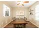 Warm dining area with a large wood table and a charming view into another room at 4337 S Helix --, Mesa, AZ 85212