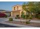 Charming two-story home featuring a brick driveway, a 2-car garage, and well-manicured landscaping at 4337 S Helix --, Mesa, AZ 85212