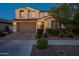 Charming two-story home featuring a brick driveway, a 2-car garage, and well-manicured landscaping at 4337 S Helix --, Mesa, AZ 85212