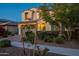 Charming two-story home featuring a brick driveway, a 2-car garage, and well-manicured landscaping at 4337 S Helix --, Mesa, AZ 85212