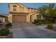 Charming two-story home featuring a brick driveway, a 2-car garage, and well-manicured landscaping at 4337 S Helix --, Mesa, AZ 85212