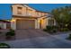 Charming two-story home featuring a brick driveway, a 2-car garage, and well-manicured landscaping at 4337 S Helix --, Mesa, AZ 85212