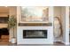 Modern fireplace with white shiplap, a wooden mantle, and stylish decor accents at 4337 S Helix --, Mesa, AZ 85212