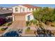 Charming two-story home features a well-manicured front yard, a tile roof, and a welcoming entrance at 4337 S Helix --, Mesa, AZ 85212