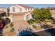 This home boasts a well-maintained front yard, charming curb appeal, and a beautiful, blue front door at 4337 S Helix --, Mesa, AZ 85212