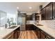 Beautiful kitchen boasting stainless appliances, wooden cabinets, quartz countertops, and a tiled backsplash at 4337 S Helix --, Mesa, AZ 85212