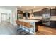 Well-lit kitchen features stainless appliances, ample cabinet space, a center island, and sleek countertops at 4337 S Helix --, Mesa, AZ 85212