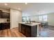 Kitchen island overlooking a living area boasts sleek countertops and stainless steel dishwasher at 4337 S Helix --, Mesa, AZ 85212