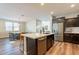 Open-concept kitchen with a center island, stainless steel appliances, and ample cabinet space at 4337 S Helix --, Mesa, AZ 85212
