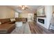 Spacious living room with a plush sectional, fireplace, and easy access to other living spaces at 4337 S Helix --, Mesa, AZ 85212