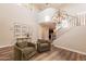 Bright living room with hardwood floors, a staircase, and a striking light fixture at 4337 S Helix --, Mesa, AZ 85212