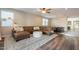 Stylish living room featuring a comfortable sectional and seamless flow into the dining area at 4337 S Helix --, Mesa, AZ 85212