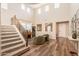 Spacious living room featuring hardwood floors, a staircase, and soaring ceilings at 4337 S Helix --, Mesa, AZ 85212