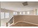 Spacious loft area with abundant natural light from numerous windows, perfect for flexible living at 4337 S Helix --, Mesa, AZ 85212