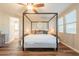 Bright main bedroom featuring a canopy bed, wood floors, and ample natural light at 4337 S Helix --, Mesa, AZ 85212