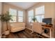 Bright office space with three large windows, a comfortable couch, and desk area at 4337 S Helix --, Mesa, AZ 85212