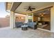Inviting covered patio with cozy seating and view into the home's stylish living area at 4337 S Helix --, Mesa, AZ 85212