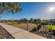 View of community playground with woodchip base and sidewalks at 4337 S Helix --, Mesa, AZ 85212