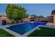 A beautiful backyard pool and patio with a relaxing seating area, perfect for entertaining at 4337 S Helix --, Mesa, AZ 85212