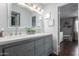 Bathroom with double vanity, modern fixtures, and large mirror at 4554 E Paradise Village Pkwy # 267, Phoenix, AZ 85032