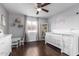 Bright bedroom with white furniture, hardwood floors, and a ceiling fan at 4554 E Paradise Village Pkwy # 267, Phoenix, AZ 85032