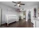 Bright bedroom features hardwood floors, access to the bathroom, and ample sunlight at 4554 E Paradise Village Pkwy # 267, Phoenix, AZ 85032