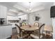 Bright dining area featuring a round wood table and decorative chairs at 4554 E Paradise Village Pkwy # 267, Phoenix, AZ 85032