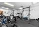 Well-equipped community gym featuring a variety of exercise machines and weights for residents at 4554 E Paradise Village Pkwy # 267, Phoenix, AZ 85032