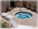 Secluded hot tub area with lounge chairs, offering a relaxing and private space at 4554 E Paradise Village Pkwy # 267, Phoenix, AZ 85032