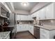 Bright kitchen with white cabinets, stainless steel appliances and granite countertops at 4554 E Paradise Village Pkwy # 267, Phoenix, AZ 85032