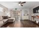 Inviting living room with dark wood floors, neutral walls and comfortable sectional sofa at 4554 E Paradise Village Pkwy # 267, Phoenix, AZ 85032
