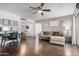 Inviting living room with dark wood floors, neutral walls and comfortable sectional sofa at 4554 E Paradise Village Pkwy # 267, Phoenix, AZ 85032