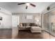 Inviting living room with dark wood floors, neutral walls and comfortable sectional sofa at 4554 E Paradise Village Pkwy # 267, Phoenix, AZ 85032