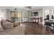 Comfortable living room features hardwood floors, ceiling fan, and sliding glass doors to the patio at 4554 E Paradise Village Pkwy # 267, Phoenix, AZ 85032