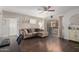 Inviting living room with dark wood floors, neutral walls and comfortable sectional sofa at 4554 E Paradise Village Pkwy # 267, Phoenix, AZ 85032