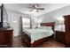Comfortable main bedroom features a ceiling fan, hardwood floors and abundant natural light at 4554 E Paradise Village Pkwy # 267, Phoenix, AZ 85032