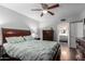This bedroom features a ceiling fan, hardwood floors, and a bathroom entrance for convenience at 4554 E Paradise Village Pkwy # 267, Phoenix, AZ 85032