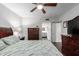 Comfortable bedroom with ceiling fan and access to an en-suite bathroom at 4554 E Paradise Village Pkwy # 267, Phoenix, AZ 85032