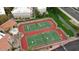 Aerial view of well-maintained tennis courts, surrounded by landscaping and residential buildings at 4554 E Paradise Village Pkwy # 267, Phoenix, AZ 85032