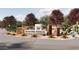 Welcome to Ventana Ranch: Entrance sign with stone accents and desert landscaping, setting a welcoming tone at 4588 S 232Nd Dr, Buckeye, AZ 85326