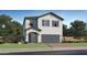 Charming two-story home with a two-car garage, a well-manicured lawn, and appealing architectural details at 4588 S 232Nd Dr, Buckeye, AZ 85326