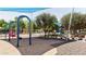 Vibrant playground area with swings and play structures, perfect for families and outdoor adventures at 4588 S 232Nd Dr, Buckeye, AZ 85326