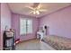 Cozy purple bedroom with window and vanity at 4815 E Everett Dr, Scottsdale, AZ 85254