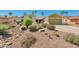 Charming single-story home featuring desert landscaping, a two-car garage, and a well-maintained front yard at 4815 E Everett Dr, Scottsdale, AZ 85254