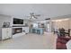 Open living area with fireplace and TV, dining area, and kitchen with stainless steel appliances at 4815 E Everett Dr, Scottsdale, AZ 85254