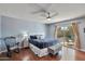 Comfortable main bedroom with wood floors, slider to backyard, and neutral decor at 4815 E Everett Dr, Scottsdale, AZ 85254