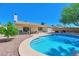 Relaxing pool with walk-in steps surrounded by a spacious patio and lush greenery, perfect for outdoor living at 4815 E Everett Dr, Scottsdale, AZ 85254