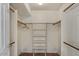 Walk-in closet featuring built-in shelving, hanging rods and carpet flooring at 509 W Boxelder Pl, Chandler, AZ 85225
